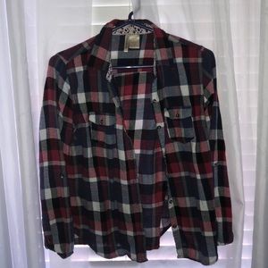 Plaid shirt with floral lining inside the collar.